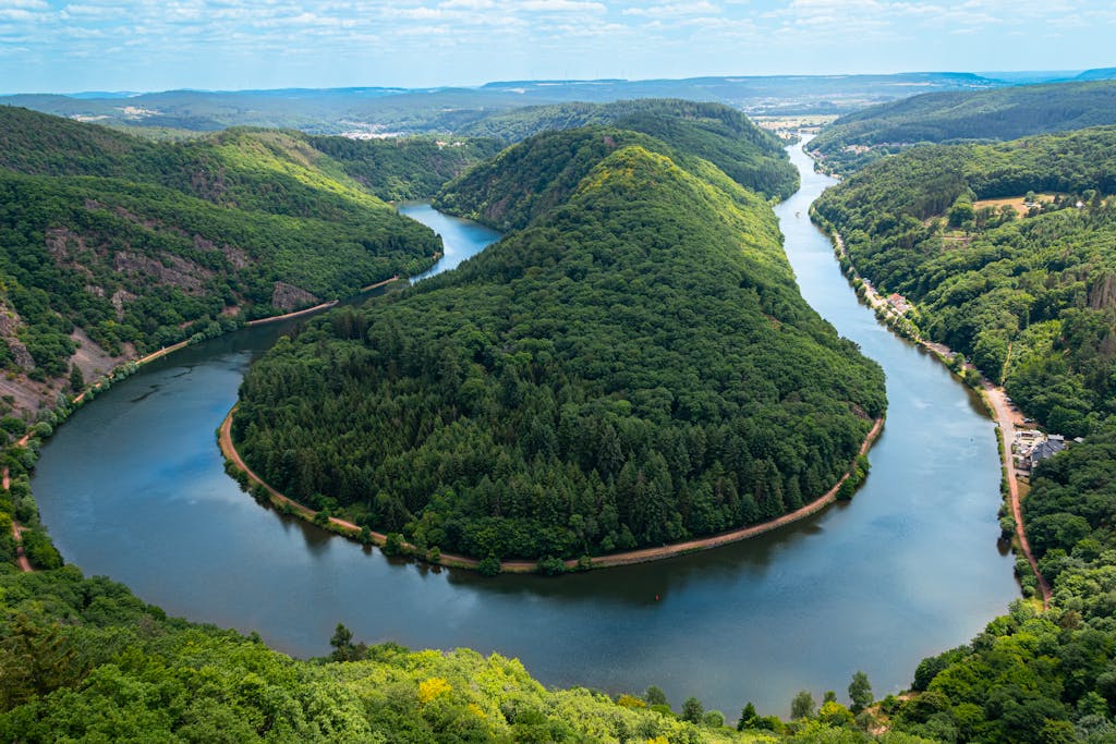 Stunning aerial view of the Saar Loop with lush greenery in Mettlach, Germany.
